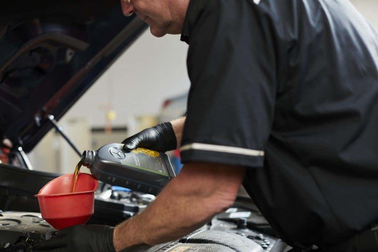Certified technician performing Mercedes-Benz Service A oil and filter maintenance at Mercedes-Benz of Richmond