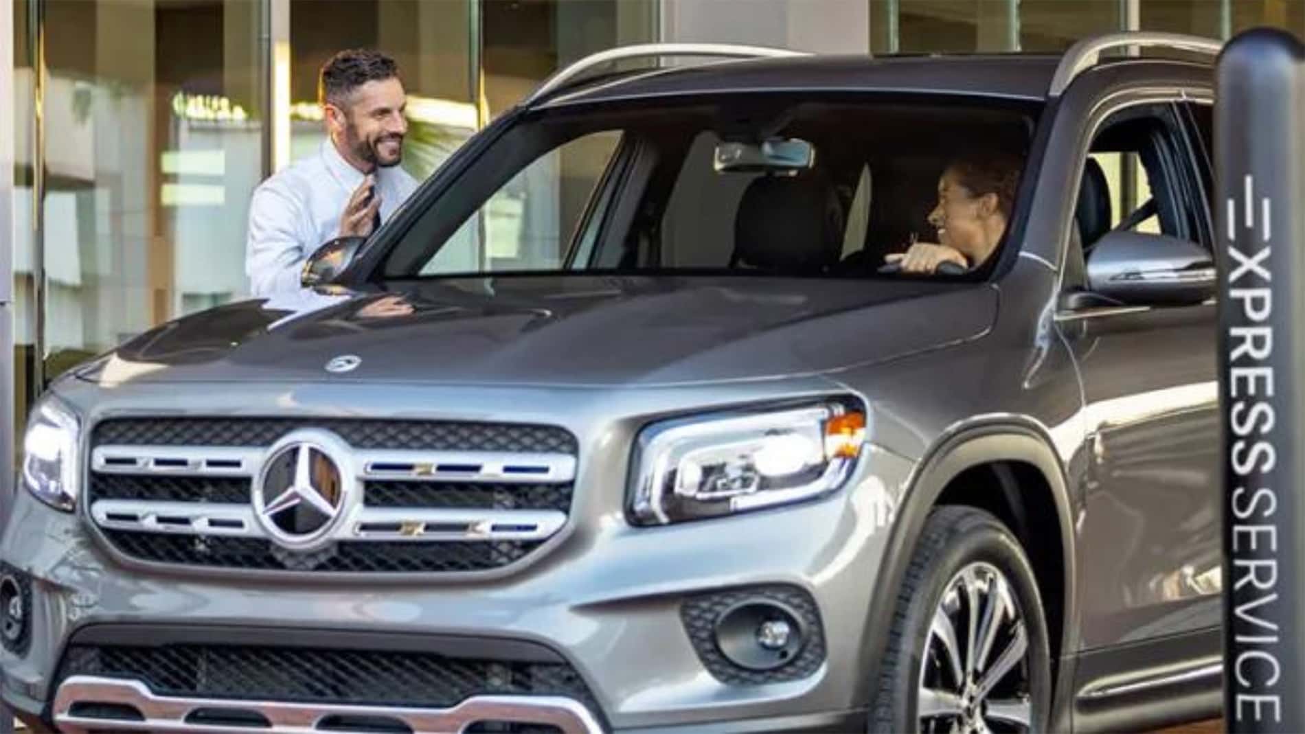 Service advisor greeting a customer at Mercedes-Benz of Richmond