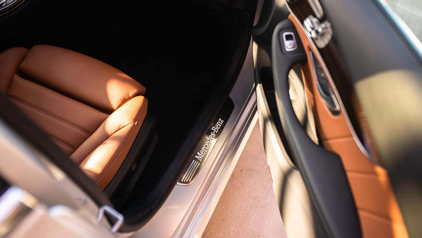 2019-Mercedes-Benz-C-Class-Sedan-stepping-through-door