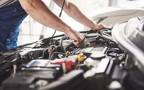 Mechanic Working On Engine