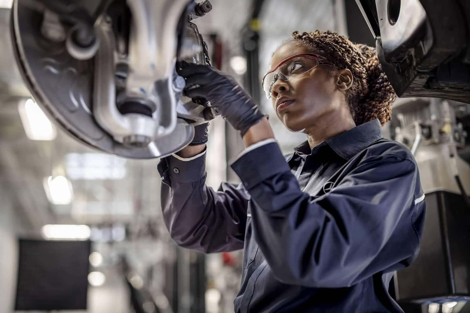 service technician working on vehicle