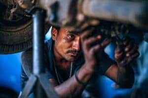 Mechanic Fixing an Air Suspension