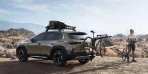 image of the back rear left of the mazda cx-50 with a bike rack on an adventure