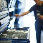 Mazda service technician searching for parts in drawers