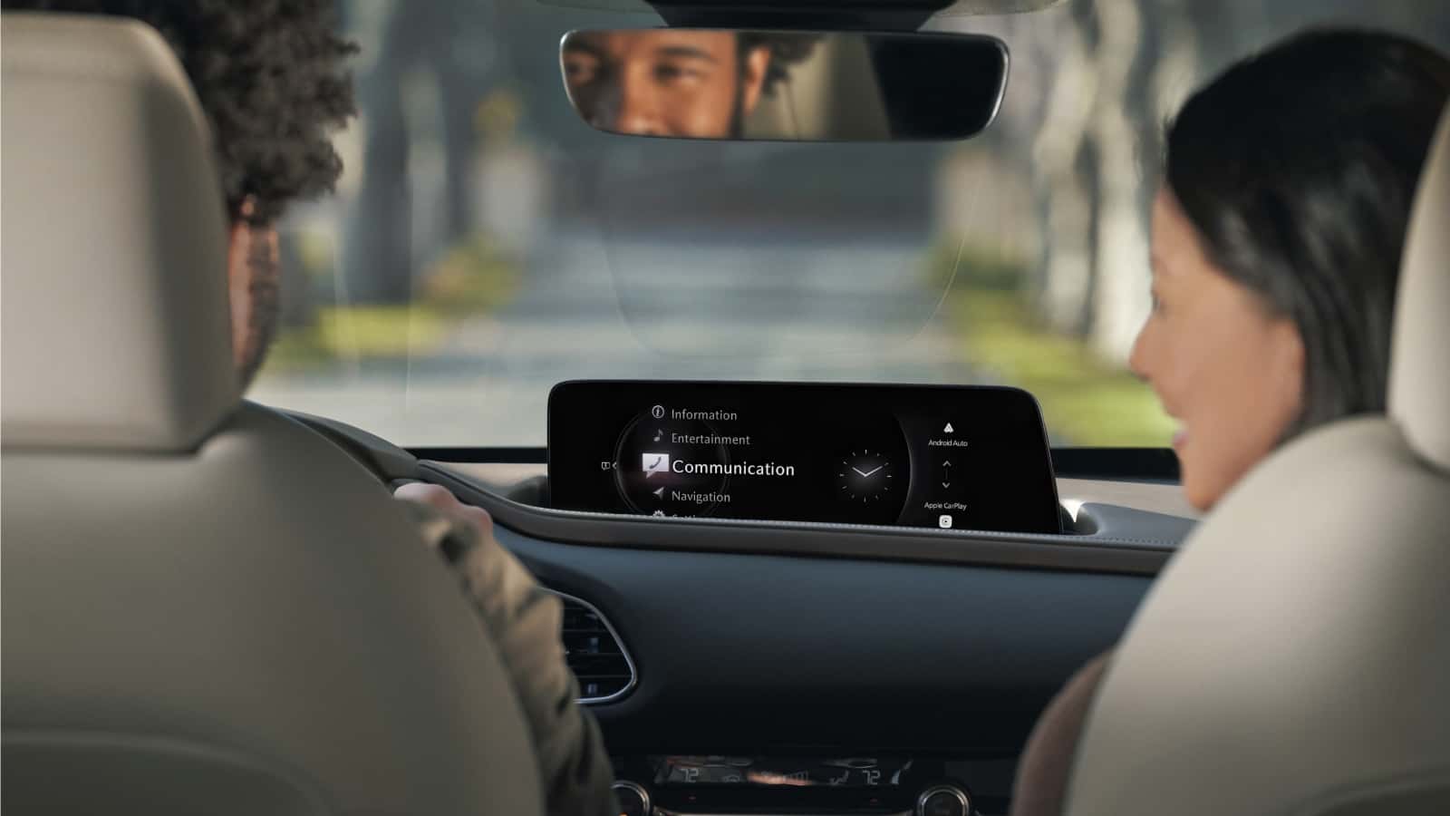 Couple in front seats of 2025 Mazda CX-30