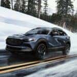 2026 Mazda CX-30 driving on the highway in winter