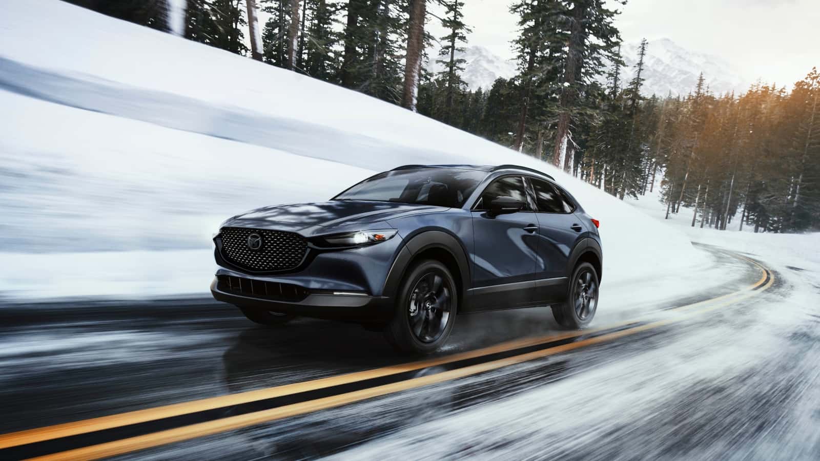 2026 Mazda CX-30 driving on the highway in winter