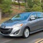 Silver 2014 Mazda5 driving on the highway