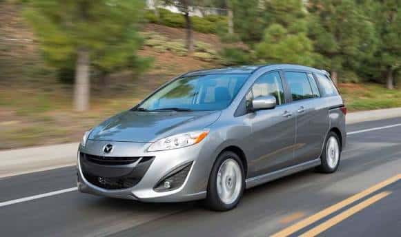 Silver 2014 Mazda5 driving on the highway