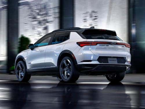 2024 Chevrolet Equinox EV driving down a street