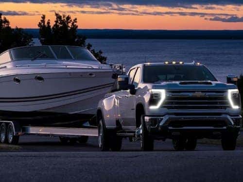 2024 Chevrolet Silverado HD towing a boat
