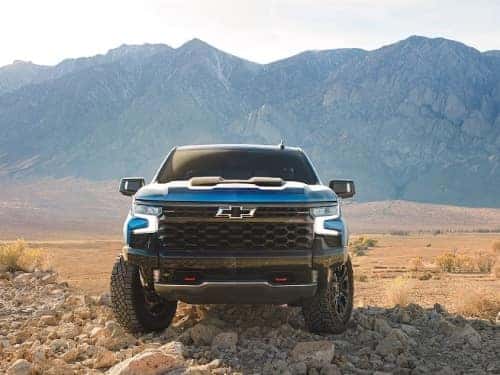 2024 Chevrolet Silverado 1500 front exterior view of truck parked in rocks