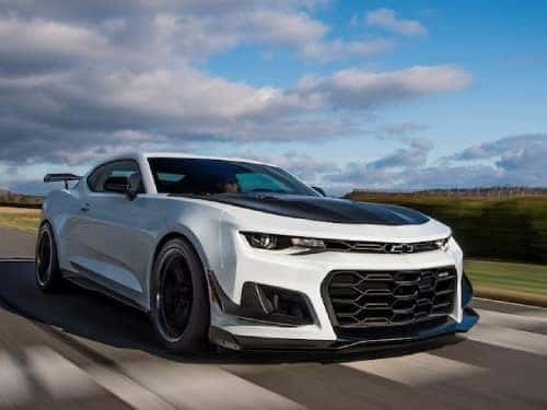 2024 Chevrolet Camaro driving fast on a track