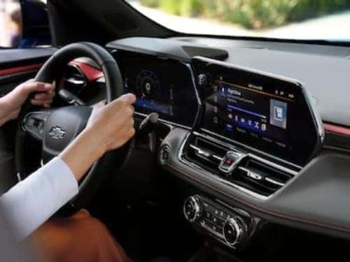 2025 Chevrolet Trailblazer view of dash and woman's hands on steering wheel
