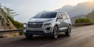 silver 2024 chevy equinox driving on a highway