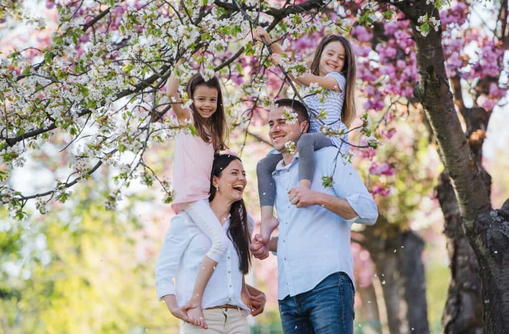 family-standing-outside-in-spring-nature