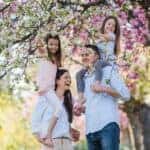 family-standing-outside-in-spring-nature
