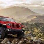 2020 Jeep Wrangler driving on rocky path