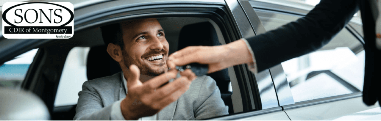 Satisfied customer test driving a used car from SONS CDJR of Montgomery dealership.