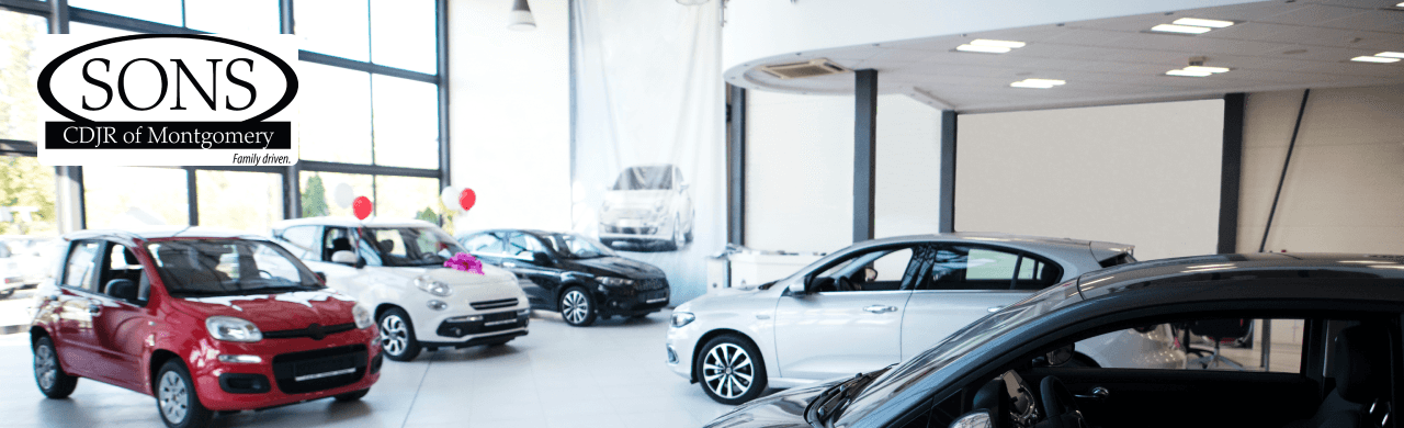 SONS CDJR of Montgomery dealership exterior showcasing various vehicles near Prattville, AL.