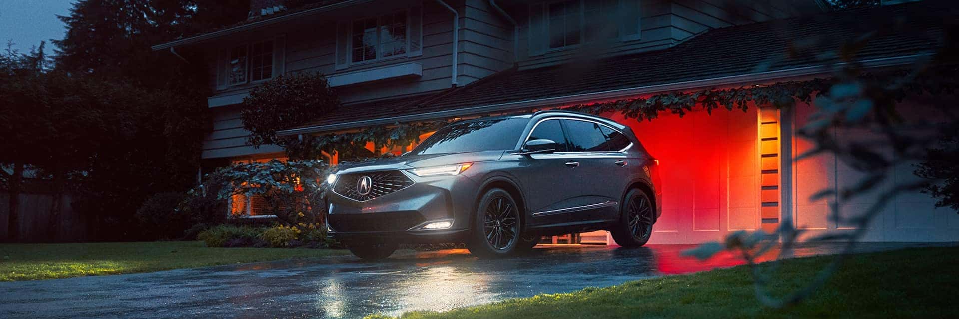 2026 mdx parked in front of home garage