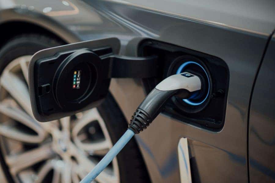 Chevrolet EV charging port plugging in EV to charge in Fort Worth, TX