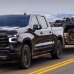 2024 Chevrolet Silverado 1500 towing on a snowy road.