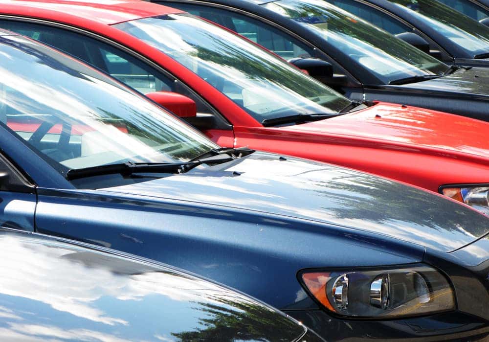 line of used cars in a row