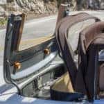 Convertible top folding into a car