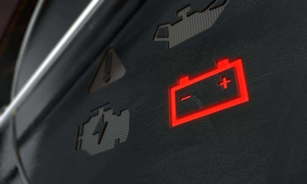 Battery light glowing on a dashboard