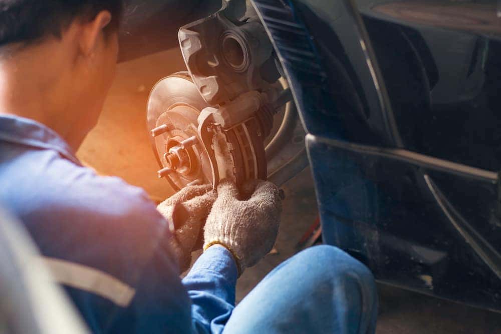 Man Installing Brakes on a Wheel