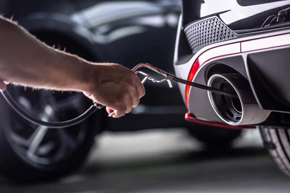 Technician Inspecting the Exhaust System