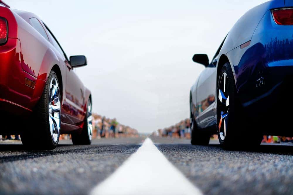 Red and Blue Car at a Drag Strip