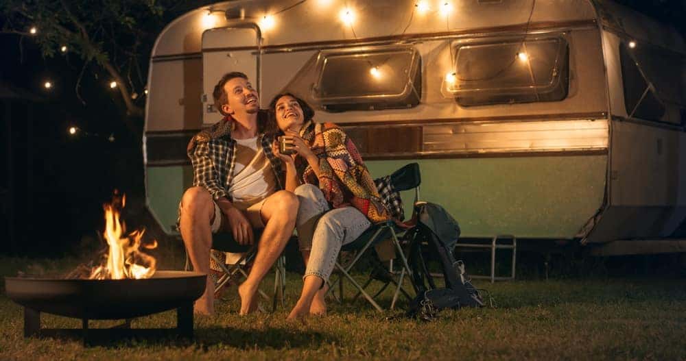 young Couple camping with an RV