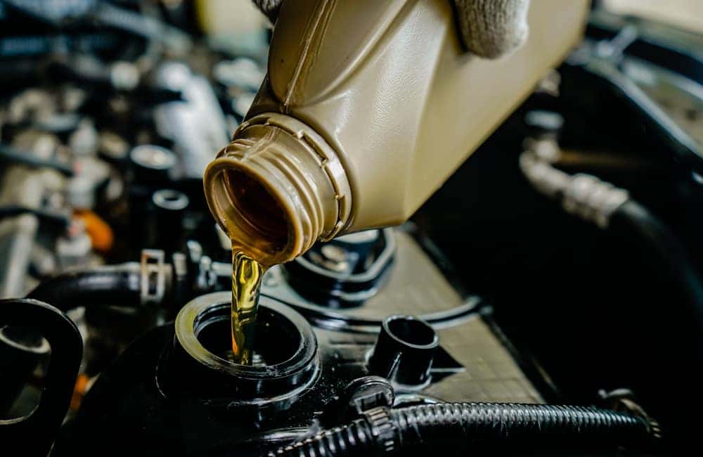 Pouring Oil Into an Engine