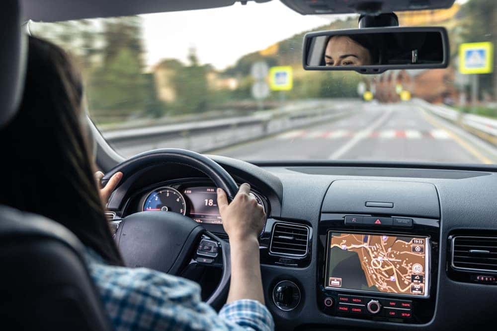 Woman Driving Two Hands on the Wheel