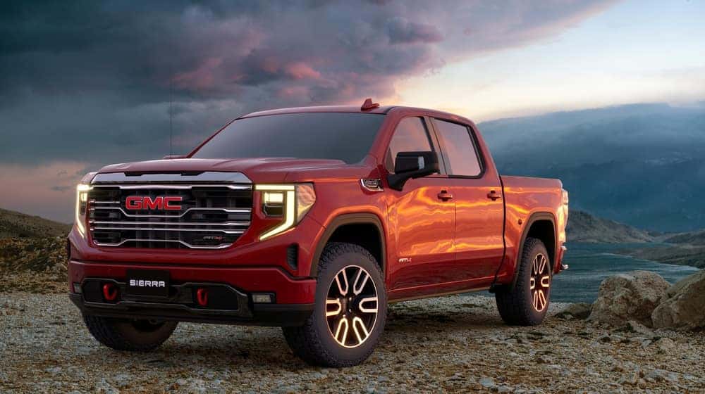 Red GMC against a nature backdrop