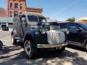 old black car parked on the street