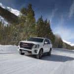 yukon suv on a snowy road